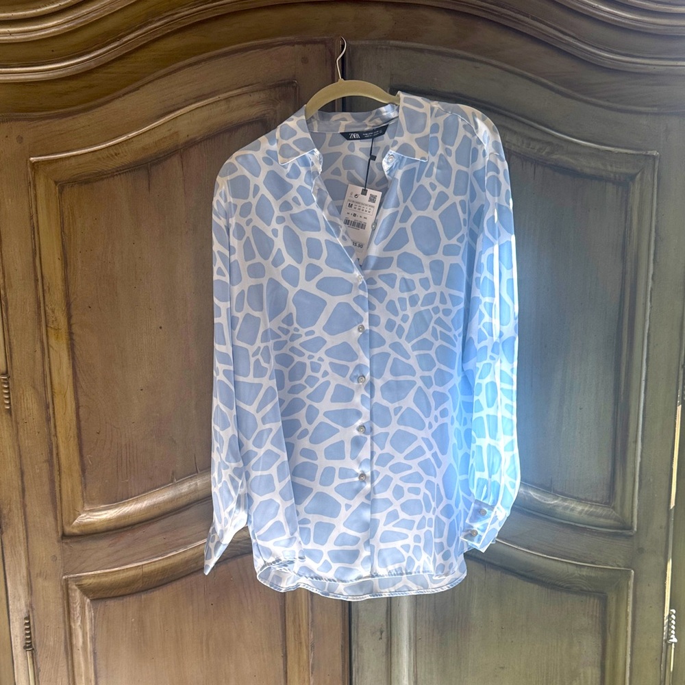 Zara Light Blue and White animal print blouse.